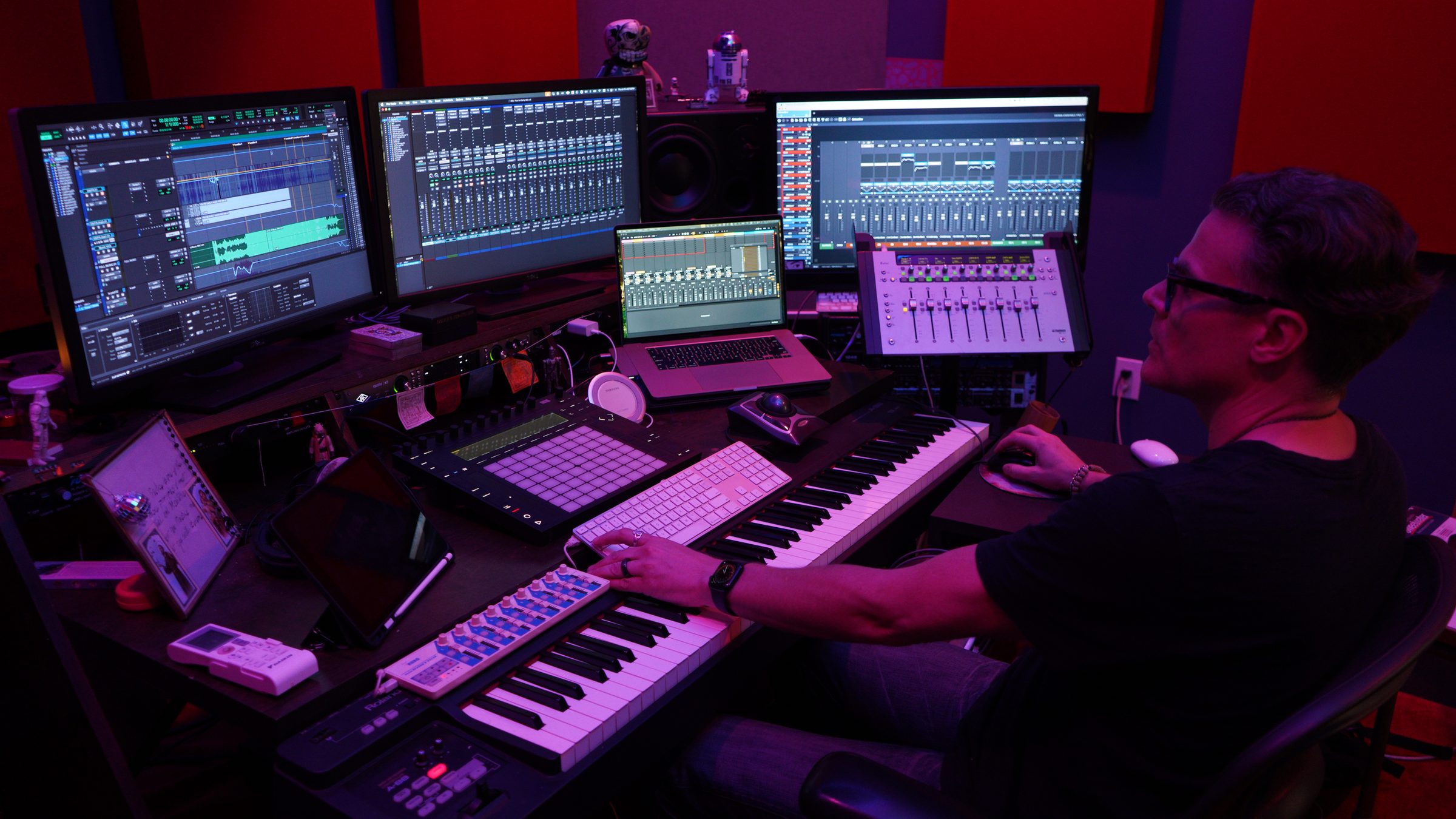 Greg Maloney at his studio desk, screens and mixing board